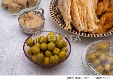 Green olives fruit close up top view, food background Green olives fruit close up top view, food background 140058376