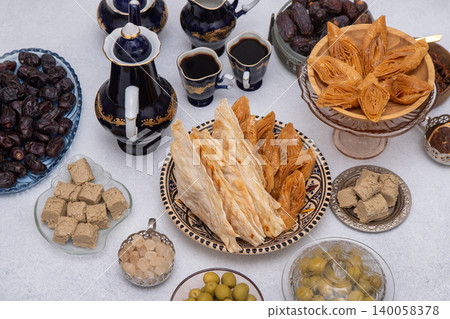 Food and drink on table top view gray background. Coffee cups and sweets Food and drink on table top view gray background. Coffee cups and sweets 140058378
