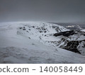 A scene from the summit of Mount Kattadake in Zao during the depths of winter in February, where heavy snow clouds envelop the ice-covered Kagamiike and Okama craters. 140058449