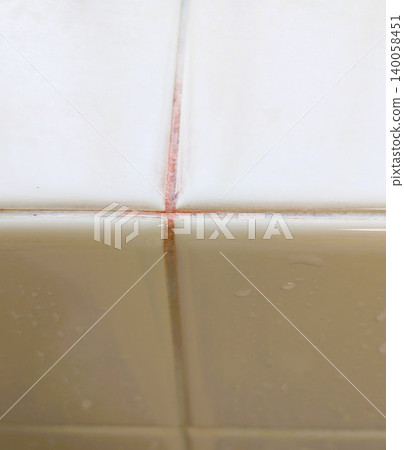 Red mold on tiles 140058451