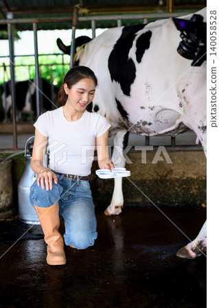 Testing raw milk quality before milking process in dairy farm barn Testing raw milk quality before milking process in dairy farm barn 140058528