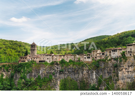 Castellfollit de la Roca village on basalt cliff in Catalonia Spain Castellfollit de la Roca village on basalt cliff in Catalonia Spain 140058617