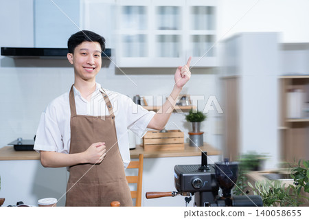 Asian male barista wear apron at counter bar with smile face, cafe service concept, owner business startup. 140058655