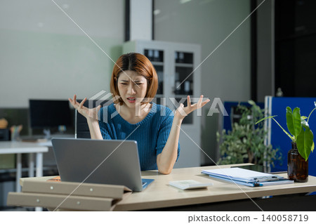 Stressed asian business woman working in the office. 140058719