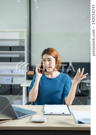 Business woman asian talking phones update plan working on laptop computers, online business. Business woman asian talking phones update plan working on laptop computers, online business. 140058745