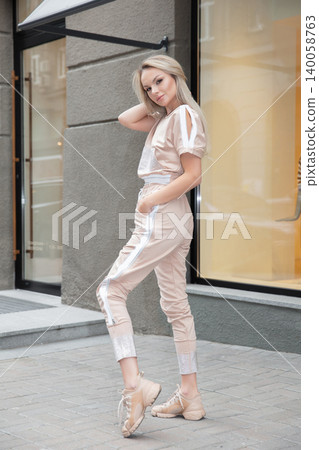 Cute woman dressed in sports suit 140058763
