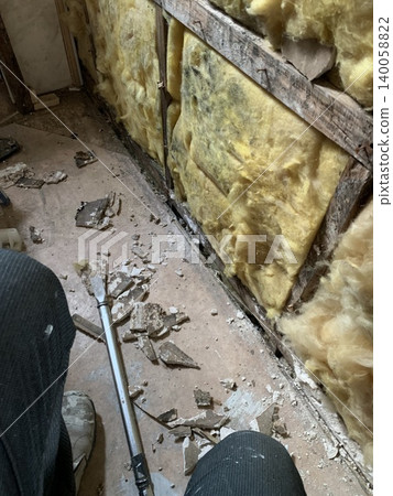 Demolition of the wall and old insulation Demolition of the wall and old insulation 140058822