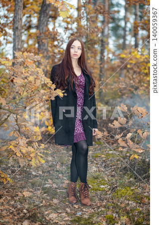 Beautiful woman in a dress and coat Beautiful woman in a dress and coat 140059367