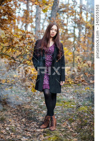 Nice woman in a dress and coat Nice woman in a dress and coat 140059368