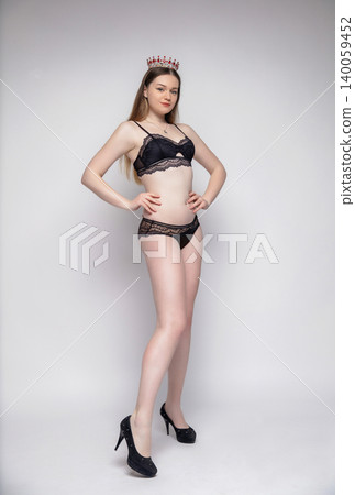 Young beautiful brunette dressed in lingerie Young beautiful brunette dressed in lingerie 140059452