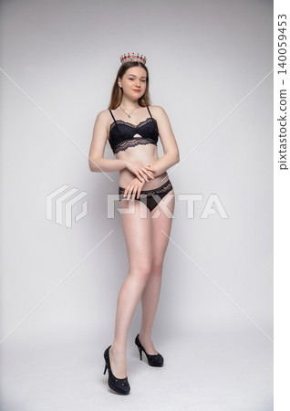 Young charming brunette dressed in lingerie 140059453