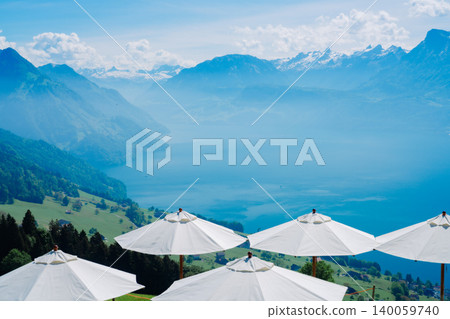 A woman overlooking Lake Lucerne from a hilltop. A woman overlooking Lake Lucerne from a hilltop. 140059740