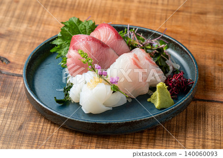 Assortment of 3 kinds of sashimi: A luxurious sashimi platter featuring fresh seafood. Assortment of 3 kinds of sashimi: A luxurious sashimi platter featuring fresh seafood. 140060093