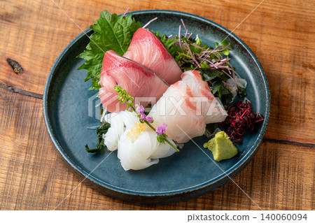 Assortment of 3 kinds of sashimi: A luxurious sashimi platter featuring fresh seafood. Assortment of 3 kinds of sashimi: A luxurious sashimi platter featuring fresh seafood. 140060094