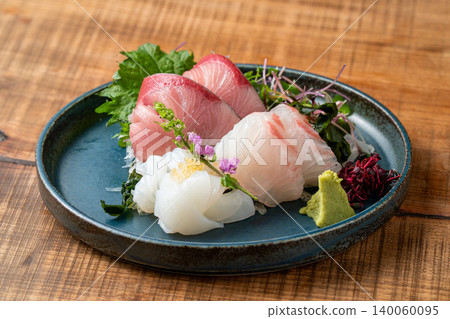 Assortment of 3 kinds of sashimi: A luxurious sashimi platter featuring fresh seafood. Assortment of 3 kinds of sashimi: A luxurious sashimi platter featuring fresh seafood. 140060095