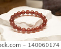 Natural stone bracelet made of strawberry quartz on display 140060174