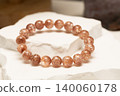 Natural stone bracelets called Tangerine on white stone surface 140060178
