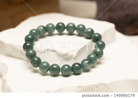 Natural stone bracelet made from Burmese Jade on white stone 140060179