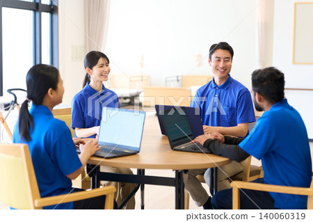 Asian caregivers hold a meeting at a nursing home. Asian caregivers hold a meeting at a nursing home. 140060319