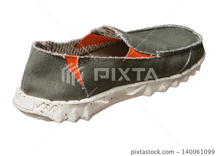 Back view of men's khaki canvas slip-on shoe with orange inserts isolated on white background. Casual textile summer footwear with textured rubber sole, product shot Back view of men's khaki canvas slip-on shoe with orange inserts isolated on white background. Casual textile summer footwear with textured rubber sole, product shot 140061099