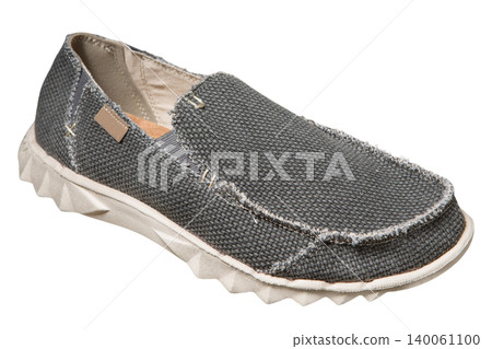 Men's grey canvas slip-on shoe isolated on white background. Casual male textile loafer with textured burlap fabric and white rubber sole, side view product shot Men's grey canvas slip-on shoe isolated on white background. Casual male textile loafer with textured burlap fabric and white rubber sole, side view product shot 140061100