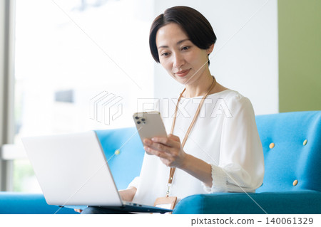 Middle-aged female engineers working in an office Middle-aged female engineers working in an office 140061329