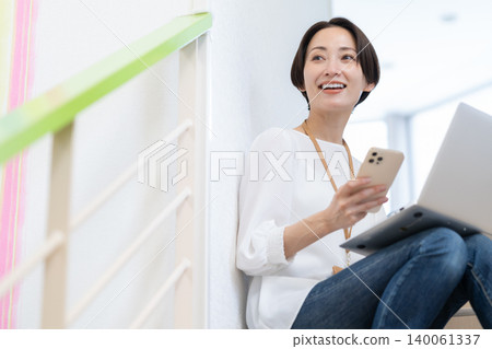Middle-aged female engineers working in an office Middle-aged female engineers working in an office 140061337