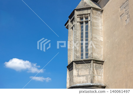 Gothic bay window with blue sky in the background. Gothic bay window with blue sky in the background. 140061497