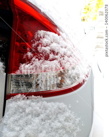 Snow on the car's taillights Snow on the car's taillights 140062078