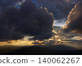 Mountain range at dusk and glowing clouds 140062267