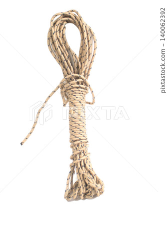 The ropes are neatly stored, rolled up into a basket, with a white background. The ropes are neatly stored, rolled up into a basket, with a white background. 140062392