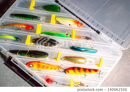Transparent fishing tackle box containing lures hooks bobber. Image for fishing themes Transparent fishing tackle box containing lures hooks bobber. Image for fishing themes 140062508