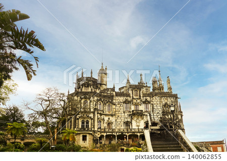 Low angle view of the neo-Gothic Quinta da Regaleira palace under blue sky in Sintra, Portugal Low angle view of the neo-Gothic Quinta da Regaleira palace under blue sky in Sintra, Portugal 140062855