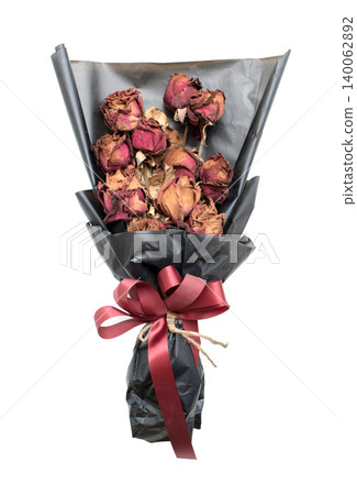 A bouquet of withering red roses isolated on white background A bouquet of withering red roses isolated on white background 140062892