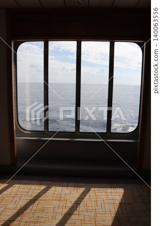 The sea and blue sky as seen from the window of the cruise ship. 140063556