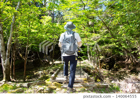 Japanese men who enjoy mountain climbing and hiking 140064555