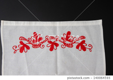 Traditional Ukrainian rushnyk with red floral embroidery. Ethnic handmade white linen towel ornament Traditional Ukrainian rushnyk with red floral embroidery. Ethnic handmade white linen towel ornament 140064593