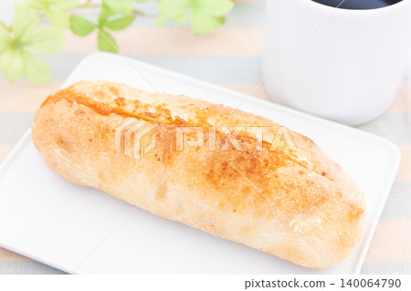 A delicious mentaiko baguette and coffee for breakfast. A delicious mentaiko baguette and coffee for breakfast. 140064790