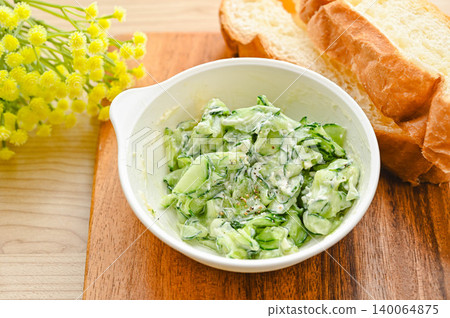 Cucumber with cream cheese and baguette Cucumber with cream cheese and baguette 140064875