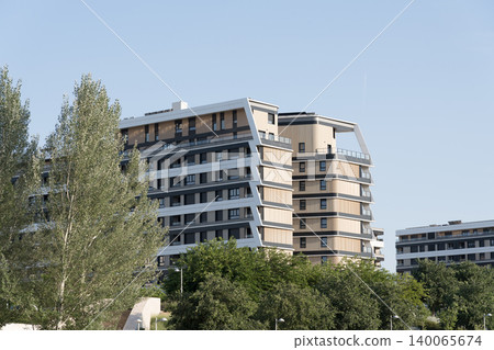 Modern residential buildings surrounded by urban greenery Modern residential buildings surrounded by urban greenery 140065674