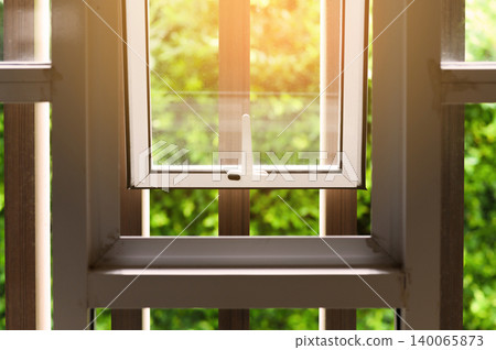 Opened aluminium window with latch handle 140065873