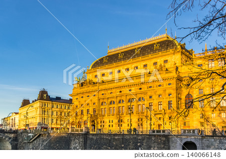 National Theatre Neo-Renaissance facade illuminated by golden afternoon light on Vltava embankment, Prague, Czech Republic National Theatre Neo-Renaissance facade illuminated by golden afternoon light on Vltava embankment, Prague, Czech Republic 140066148