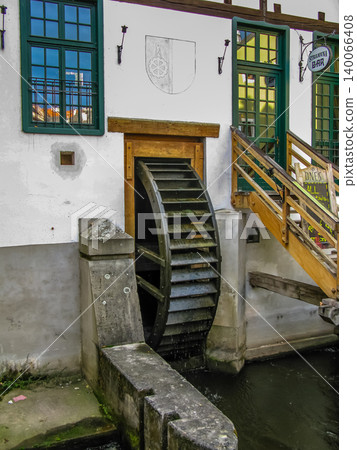 Historic water mill wheel on canal beside Strojovna Bar in Cesky Krumlov, Czech Republic Historic water mill wheel on canal beside Strojovna Bar in Cesky Krumlov, Czech Republic 140066408