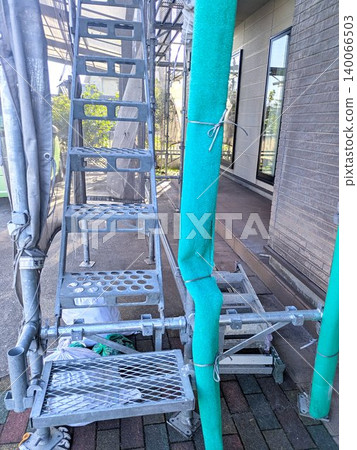 Metal scaffolding and stairs erected for home renovation work. 140066503