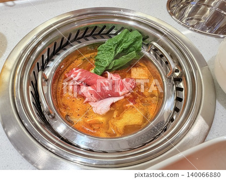 Chinese Hot Pot with Spicy Broth and Fresh Ingredients Chinese Hot Pot with Spicy Broth and Fresh Ingredients 140066880