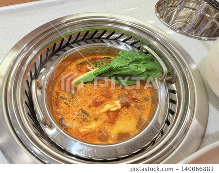 Chinese Hot Pot with Spicy Broth and Fresh Ingredients Chinese Hot Pot with Spicy Broth and Fresh Ingredients 140066881