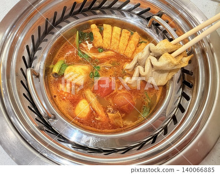Chinese Hot Pot with Spicy Broth and Fresh Ingredients 140066885