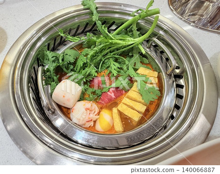 Chinese Hot Pot with Spicy Broth and Fresh Ingredients 140066887