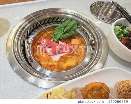 Chinese Hot Pot with Spicy Broth and Fresh Ingredients Chinese Hot Pot with Spicy Broth and Fresh Ingredients 140066889