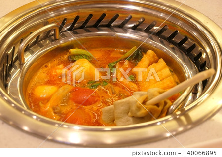 Chinese Hot Pot with Spicy Broth and Fresh Ingredients Chinese Hot Pot with Spicy Broth and Fresh Ingredients 140066895